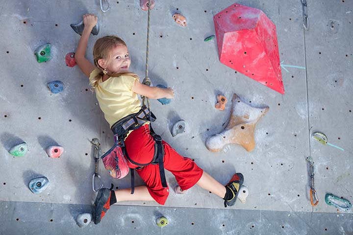 Little girl rock climbing